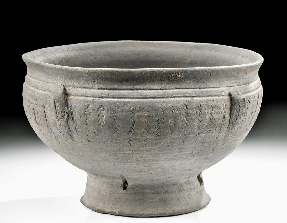 Korean Three Kingdoms Silla Stoneware Bowl: East Asia, Korea, Three Kingdoms period, Silla Kingdom, ca. 5th to 6th century CE. An elegant footed gray stoneware bowl covered with ash glaze created as a result of significant technological advance