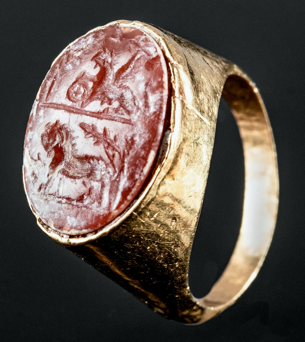 Roman 18K+ Gold Ring Carnelian Intaglio Winged Griffin: For every order (single or multiple lots) in this auction, Artemis Gallery will donate 25 meals to Community Food Share, a Feeding America Food Bank. Roman, early Imperial Period, ca. 1st to early 2nd