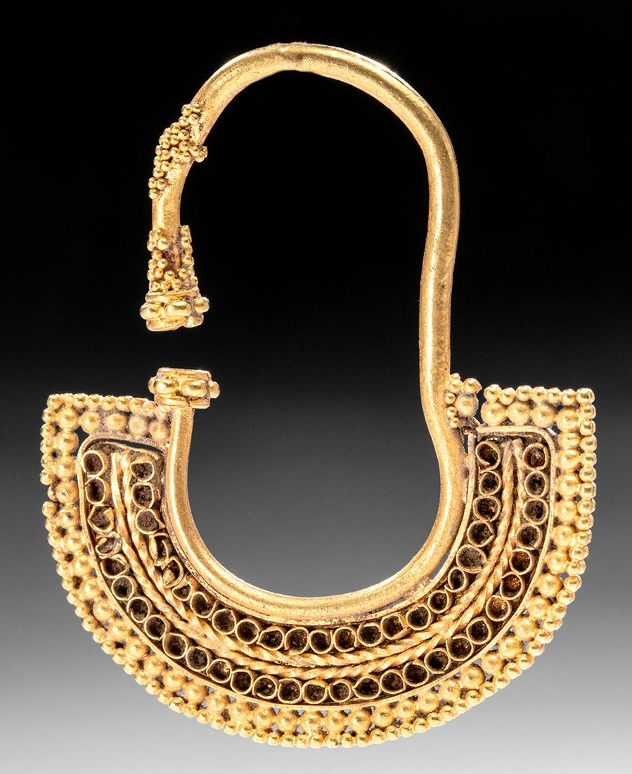 South Arabian 21K+ Gold Earring Granule Border: For every order (single or multiple lots) in this auction, Artemis Gallery will donate 25 meals to Community Food Share, a Feeding America Food Bank. Ancient Near East, South Arabia, ca. 5th century B