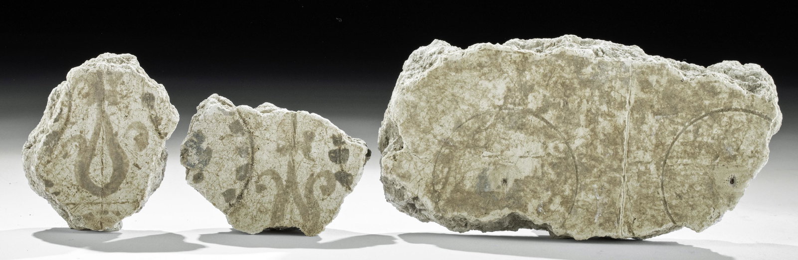 Lot of 3 Roman Fresco Fragments from Pompeii: **First Time At Auction** Roman, Pompeii, early Imperial Period, ca. 1st century CE. A gathering of three painted plaster fragments from large frescos that at one time decorated the city of Pompeii. T