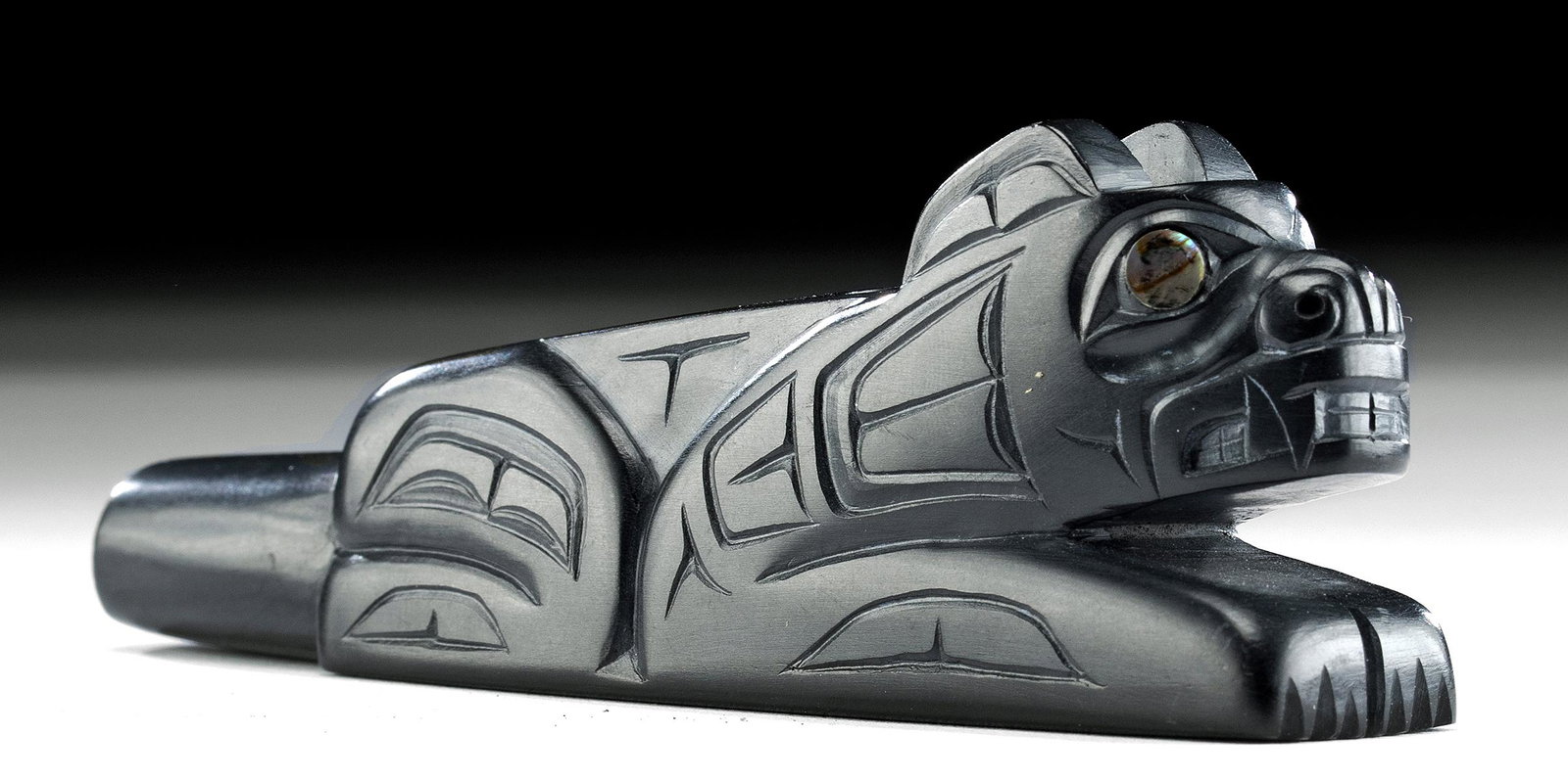 Haida Argillite Bear Pipe w. Abalone Inlay, G. Pollard: **First Time At Auction** Native American, Pacific Northwest, Haida, British Columbia, ca. 1980 CE. Signed by Glen Pollard (b. 1957 in Haida Gwaii). A compelling black argillite pipe finely carved in