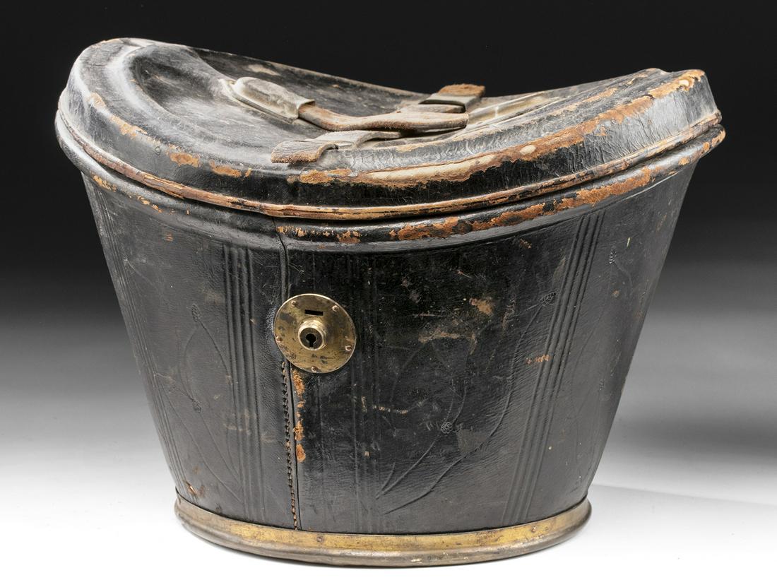 19th C. American Leather Hat Box w/ Travel Labels: **Originally Listed At $150** North America, USA, ca. second half of the 19th century CE. A handsome leather hat box, made for carrying a top hat, with a deep body and curved lid. The lid features two