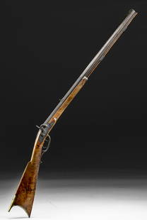 Mid-19th C. American Child's Percussion Rifle: North America, United States, ca. mid-19th century CE. A beautiful percussion rifle, hand-carved from finely grained hardwood, that was meant for a child. The octagonal barrel rests above the ram rod