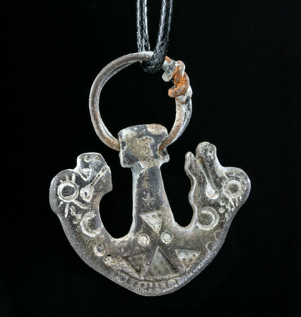 Viking Silver Pendant of Skoll and Hati - 12.8 g: Northern Europe, Viking/Norse culture, ca. 9th to 12th century CE, probably later in the period. A rare find, a 97% silver pendant with a round loop for suspension and a flat shank with a cast and sta