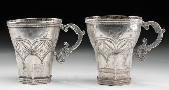 Two 19th C. Spanish Colonial Silver Cups, 205.2 g: Spanish Colonial, South America, probably Peru, ca. early 19th century CE. A fine pair of petite cups formed from 70% to 80% silver with flat bases, wide rims, and intricately shaped foliate-style