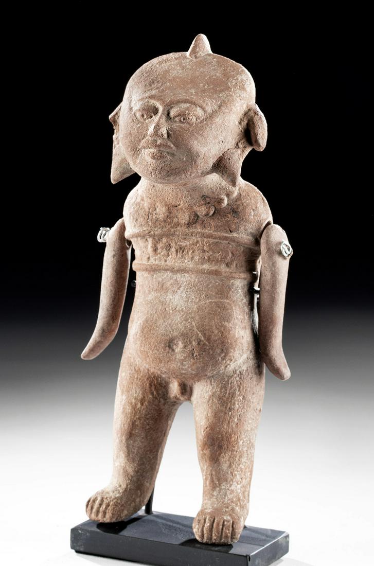 Veracruz Pottery Articulated Figure, ex Sotheby's: Pre-Columbian, Mexico, Gulf Coast, Veracruz, Classic Period, ca. 100 BCE to 900 CE. An amazing molded terracotta standing figure with separately made articulated arms. In antiquity, these would have b