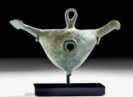 Greek Geometric Bronze Abstract Bird Pendant: Ancient Greece, Geometric Period, ca. second half of the 8th century BCE. A fine cast-bronze pendant in the form of an abstract bird with a petite head, a bulbous body with a pair of lateral