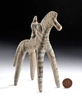 Greek Boeotian Pottery Horse and Rider, TL Tested: Greek, Boeotian, ca. 575 to 550 BCE. A wonderful hand-built terracotta horse and rider of a characteristically abstract style. Both the rider and the horse are decorated with black striations. The