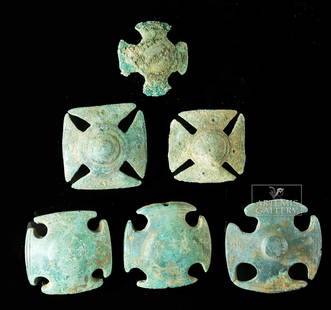 Graeco-Roman Bronze Belt Attachments (6 pieces): Graeco-Roman world, ca. late 1st millennium BCE. Six cast bronze belt buckles, each of symmetrical cross form with a round boss at the center of each. Three are pierced laterally for suspension; the