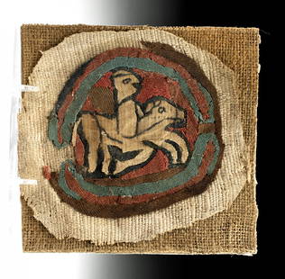 Egyptian Coptic Textile - Horse and Rider: Egypt, Coptic Period, ca. 3rd to 5th century CE. A stunning textile section in vivid colors of red, brown, green, and tan, depicting a horse with a seated rider on a red background. Textiles were