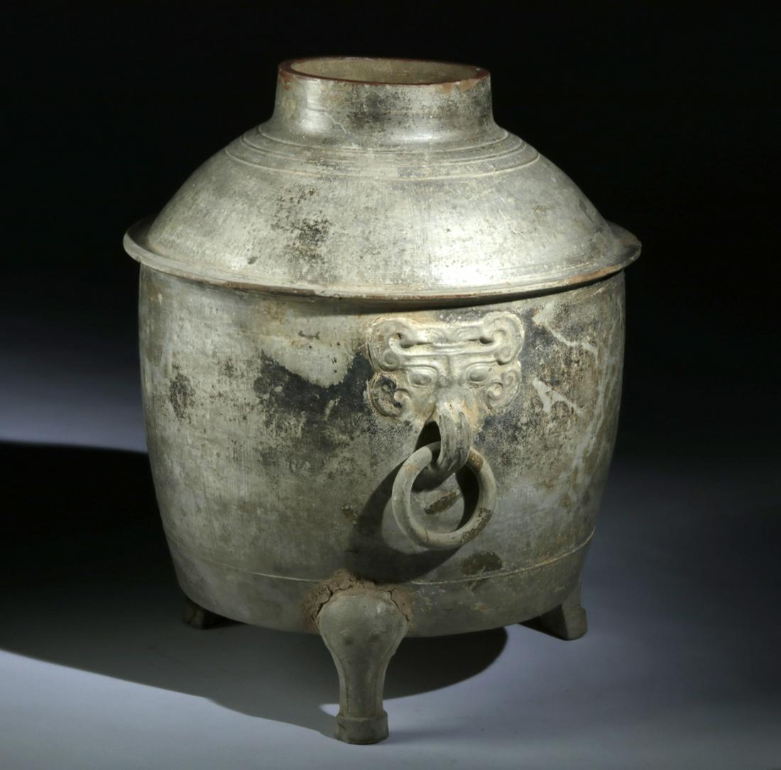 Fine Han Dynasty Terracotta Censer w/ Taotie Masks: East Asia, China, Han Dynasty, ca. 206 BCE to 220 CE. Wow! An incredible example of a ceramic censer, made to resemble bronze, with a sparkling, silvery-green low-fired glaze, an early form of celadon