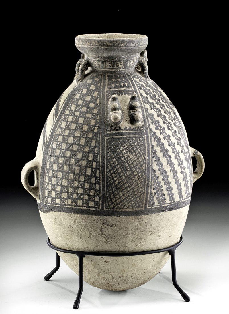 Tall Chancay Bi-chrome Amphora w/ Jaguar: Pre-Columbian, Peru, Chancay, ca. 1200 to 1470 CE. A large bichrome pottery vessel, an egg-shaped amphora used for storing and transporting chicha de jora (fermented corn beer), skillfully modeled and