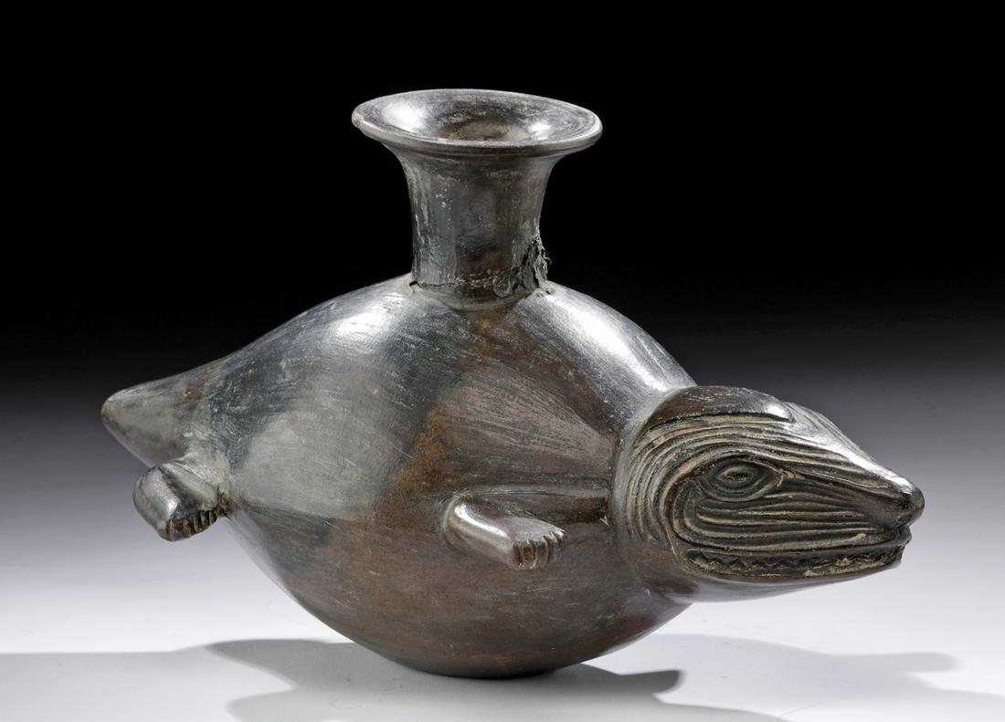 Chimu Inca Blackware Vessel Sea Lion, ex-Harmer Rooke: **Originally Listed At $400** Pre-Columbian, North Coast Peru, Chimu/Inca culture, ca. 1200 to 1500 CE. A beautiful mold-formed blackware pottery vessel of a bulbous form, depicting an abstract marine