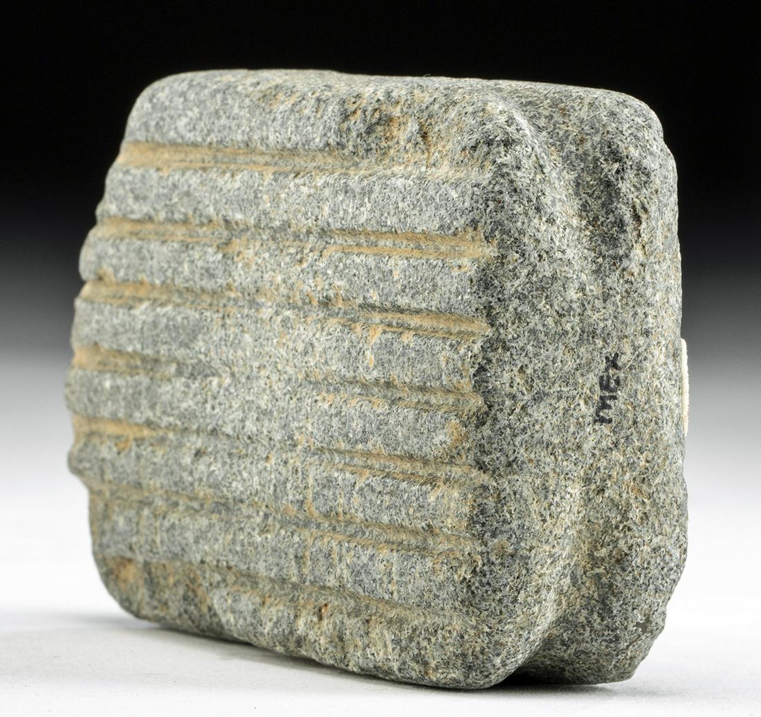 Early Oaxacan Stone Beater: **First Time At Auction** Pre-Columbian, Mexico, Oaxaca, ca. 2000 to 0 BCE. A handsome example of a stone beater, used for processing maize and maguey (a type of agave). It has an elongated, flat body