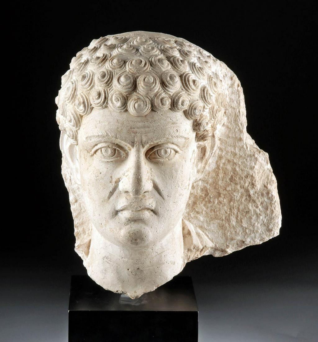 Superb Roman Peri Limestone Relief Head of Thinking Man: Ancient Near East, Palmyra, Roman Period, ca. 2nd to 3rd century CE. A Palmyrene limestone relief head of a man with a wrinkled forehead - these furrows suggesting that the man is engaged in deep thou
