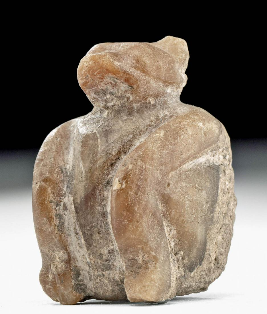 Rare Miniature Tell Brak Stone Votive - Seated Bear: Ancient Near East, Tell Brak, modern day Syria, ca. 3500 to 3300 BCE. An incredible polished miniature votive stone bear, a very ancient depiction of the brown bears who now live in isolated areas of 
