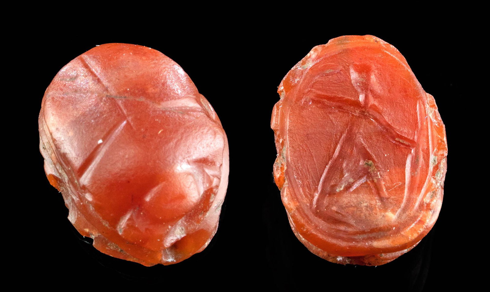Egyptian 18th Dynasty Carnelian Scarab Thutmose III: Ancient Egypt, New Kingdom, 18th Dynasty, reign of Thutmose III, ca. 1479 to 1425 BCE. A beautiful scarab that is hand-carved from vermilion-hued carnelian and displays the pharaoh Thutmose III on the
