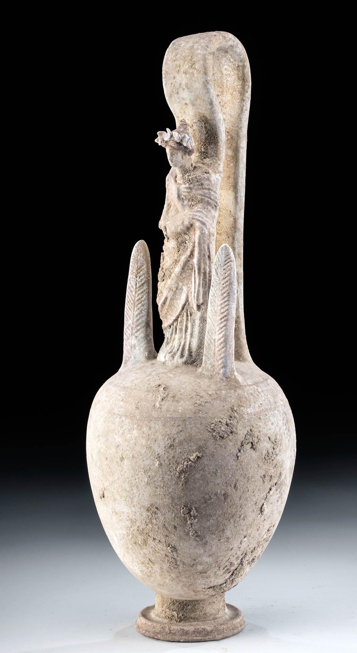 Lovely Canosan Pottery False Amphora w/ Woman: Magna Graecia, Southern Italy, Canosa, ca. 4th century BCE. A stunning closed vessel featuring a standing woman draped in a voluminous chiton and himation, her head topped by her drawn up red hair and