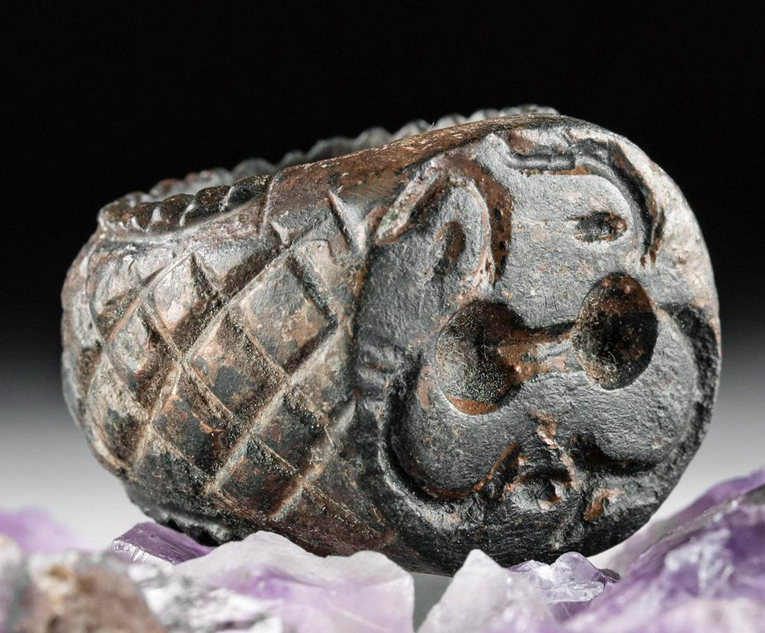 Hefty 12th C. Islamic Bronze Ring w/ Arabic Script: Ancient Near East, Holy Land, Islamic, ca. 12th to 14th century CE. A beautiful and wearable bronze ring cast via the lost wax (cire perdue) technique. The ring features a wide shank bearing crosshatc