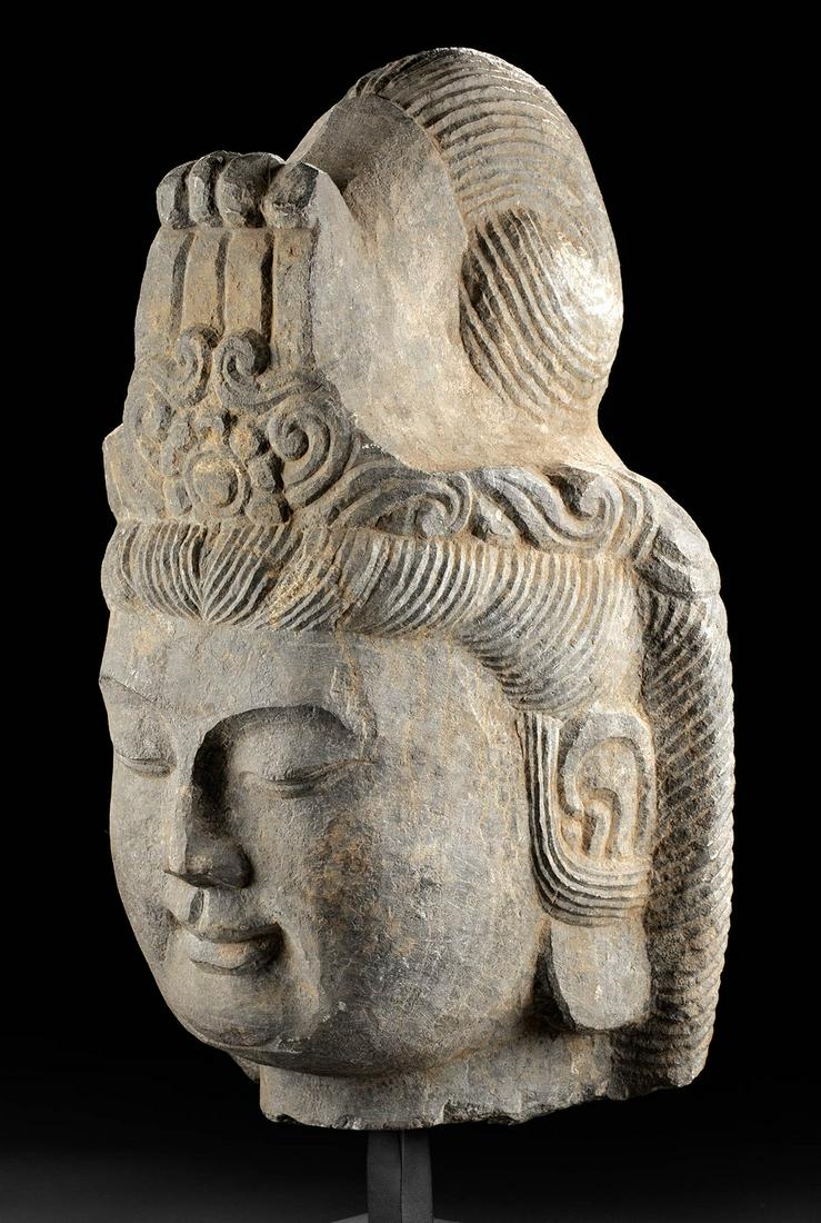 Lifesize Chinese Ming Dynasty Stone Bodhisattva Guanyin: East Asia, China, Ming Dynasty, ca. 1368 to 1644 CE. A gorgeous dark stone carved head of the bodhisattva Guanyin (Avalokiteshvara), "The Lord Who Gazes Down At The World", a figure often portrayed as
