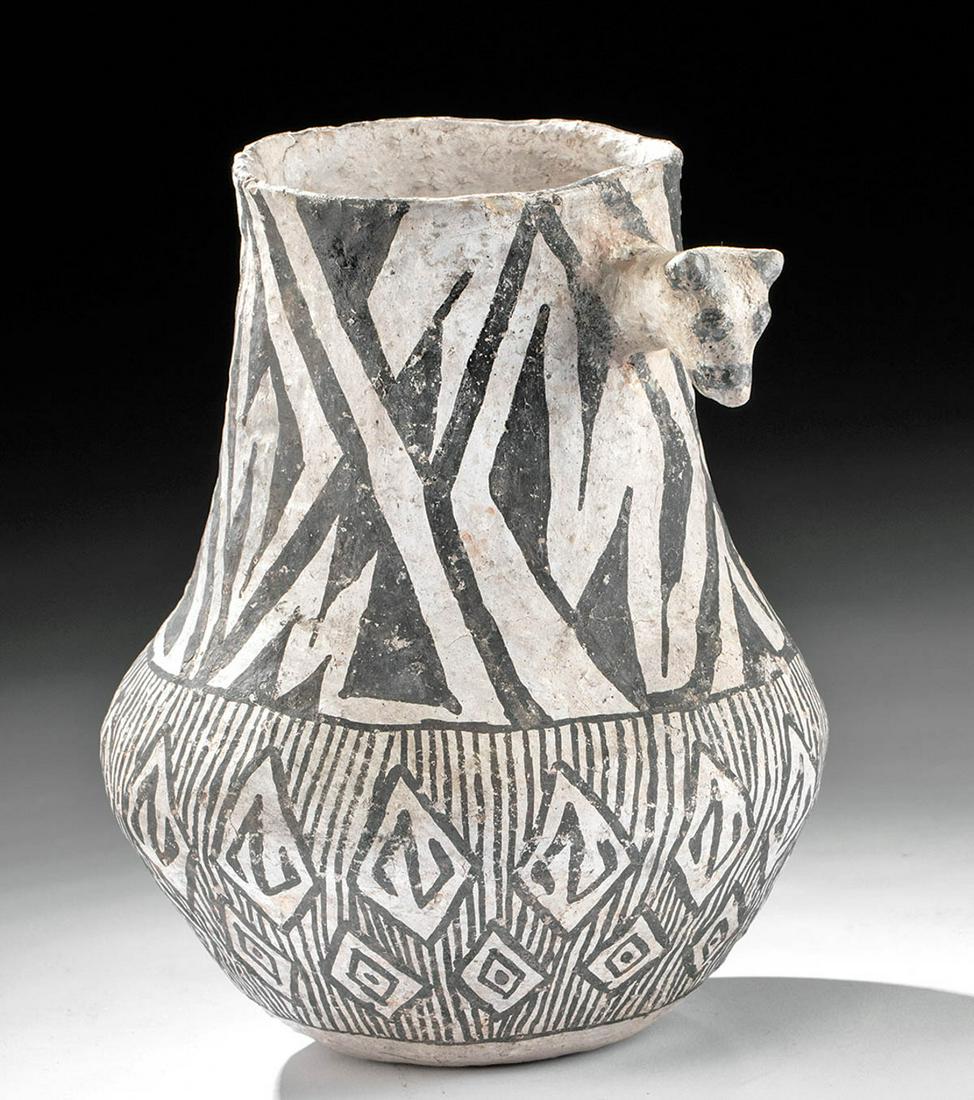 Anasazi Gallup Black-on-White Vessel Animal Head: Native American, Southwestern USA, found in central eastern Arizona, Anasazi (Ancestral Puebloan), Pueblo II, ca. 980 to 1150 CE. An outstanding example of a Gallup Black-on-White ceramic vessel with 