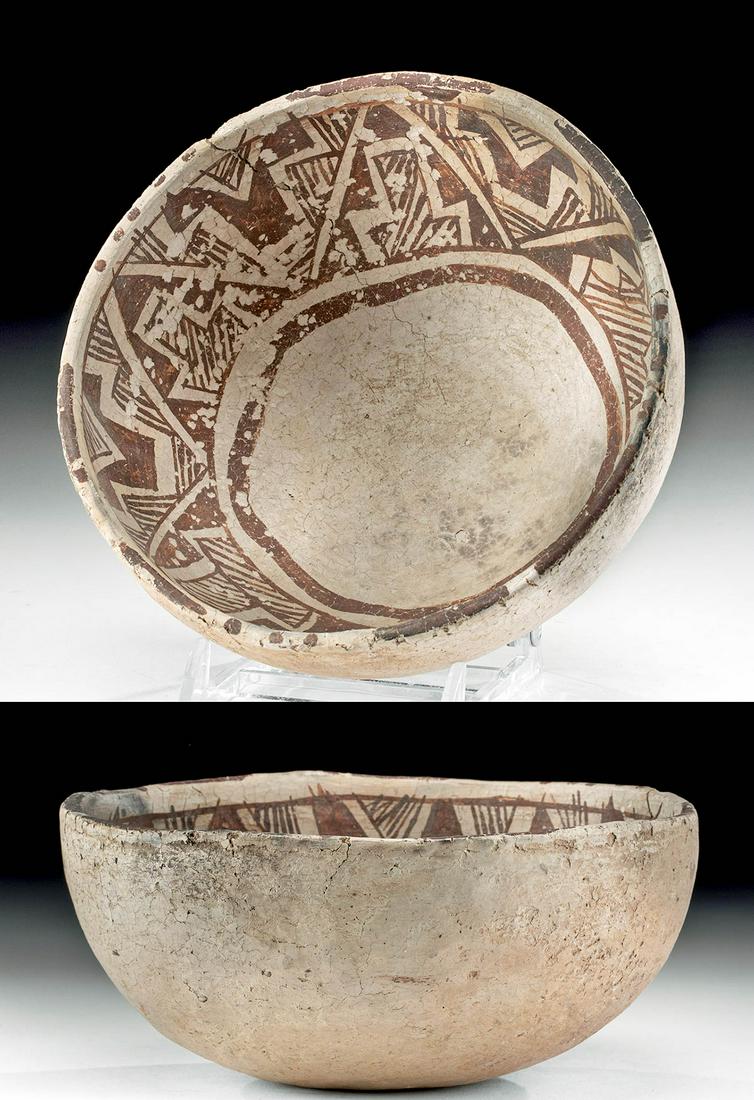 Anasazi Black-on-White Pottery Bowl: Native American, Southwestern USA, Colorado or New Mexico, Anasazi/Ancestral Puebloans, ca. 1100 to 1300 CE. A deep, steep-walled ceramic bowl with a large band around its upper interior decorated in 