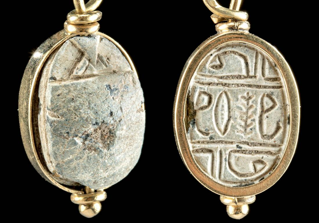 Egyptian Steatite Scarab, Gilded Pendant Setting: Ancient Egypt, New Kingdom to Late Dynastic Period, 18th to 31st Dynasty, ca. 1550 to 332 BCE. A beautiful and petite beetle-form scarab that is hand-carved from grey steatite. The topside has a retra