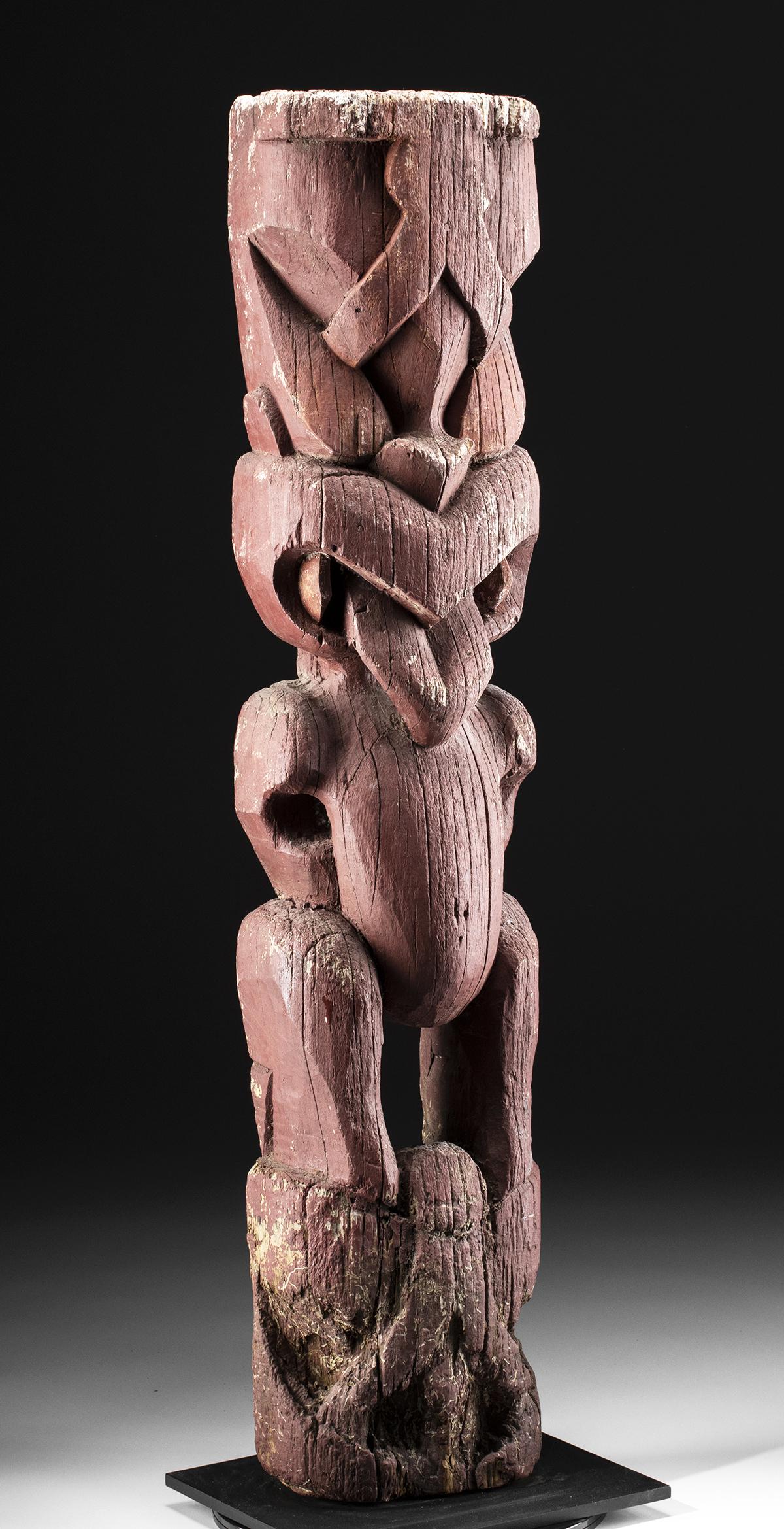 Rare 19th C. Maori Wooden Tekoteko (Carved Figure): Oceania, New Zealand, Maori, ca. 19th to early 20th century CE. A large, dramatic example of a tekoteko, an anthropomorphic figure that represents an ancestor (tupuna). The tall figure is painted enti