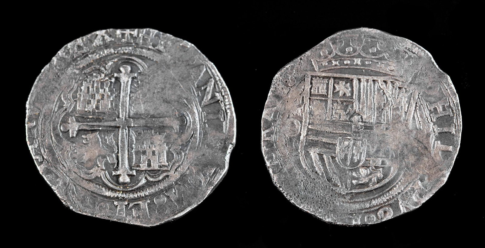 Spanish Silver Phillip II 4 Reales - 13.3 g: Spanish Empire, Philip II, ca. 1556 to 1598 CE. A large 4 reales silver coin. Obverse: Crowned shield. Reverse: Castles and lions in angles within a lobate frame. Size: 1.25" W (3.2 cm); 13.3 grams Pr