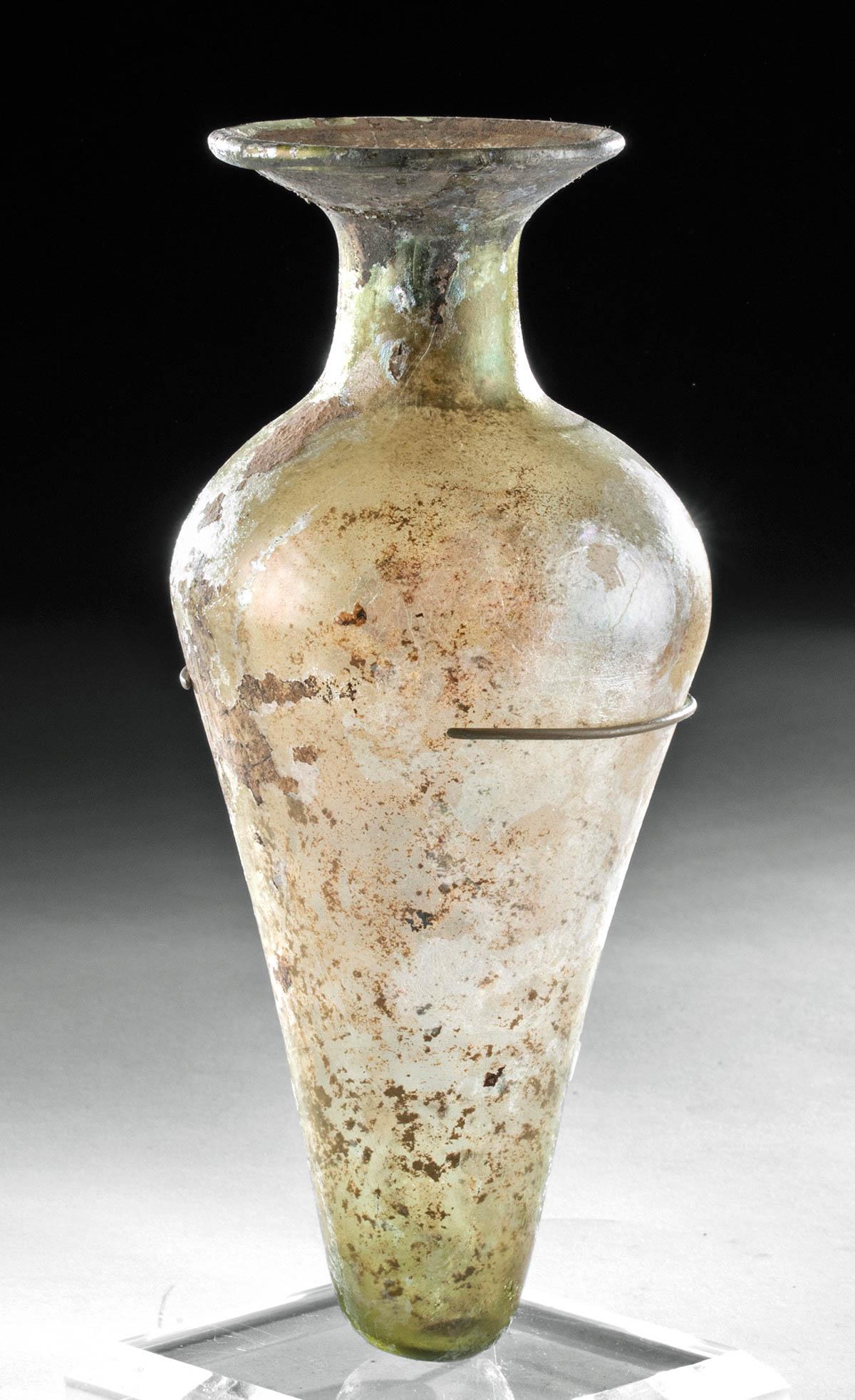 Gorgeous / Tall Roman Glass Bottle: **Originally Listed At $750** Roman, Imperial Period, ca. 1st to 3rd century CE. An elegant translucent free blown glass vessel in the shape of a pendulum, with its body tapering to a graceful curved