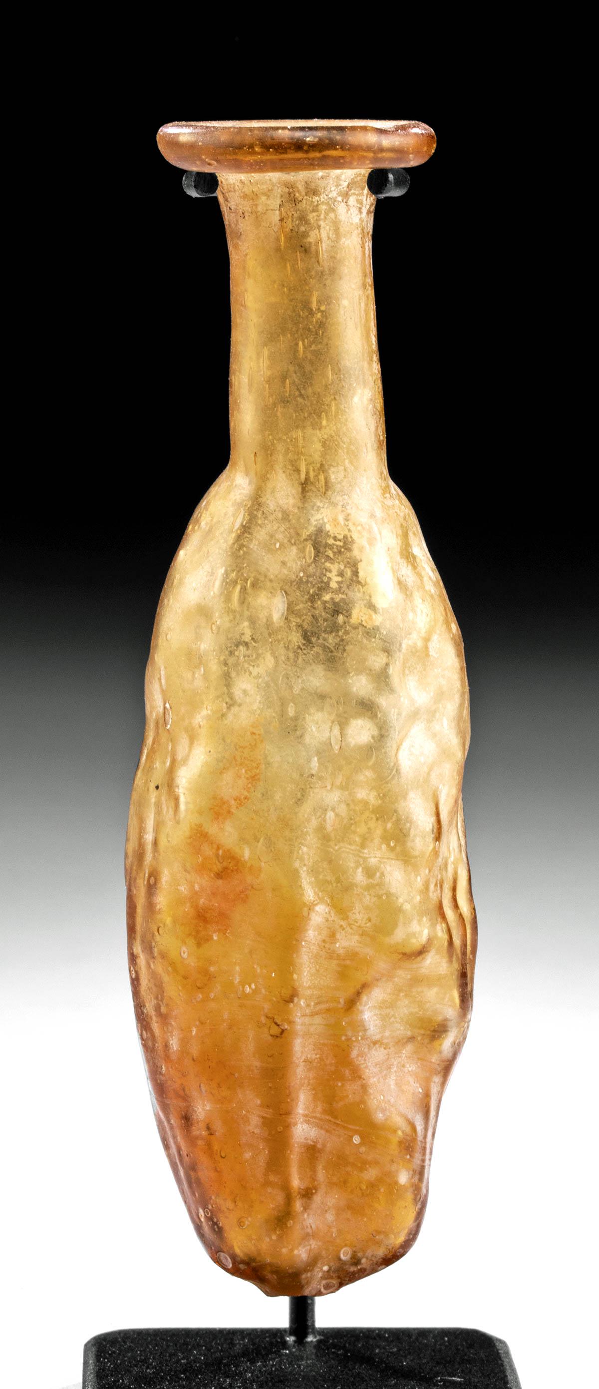 Gorgeous Roman Glass Date Flask Mold-Blown: **Originally Listed At $700** Roman Empire, Lebanon, Sidonian, ca. mid 1st to early 2nd century CE. A fine mold-blown flask resembling a date fruit in gorgeous amber glass with hues that ranges from d
