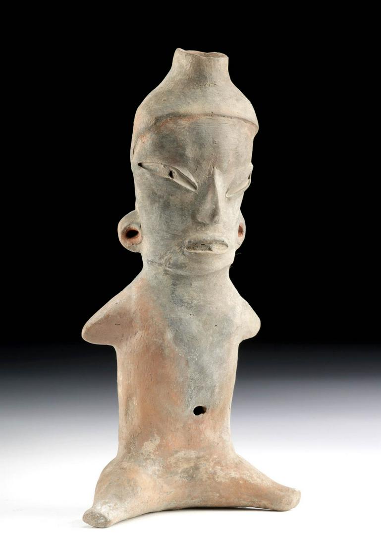 Tlatilco DK Type Pottery Seated Female Figure: Pre-Columbian, Valley of Mexico, Tlatilco culture, Early Formative period, ca. 1200 to 800 BCE. A hollow-built figurative pottery vessel of the D-K type depicting an abstract female figure. The nude w