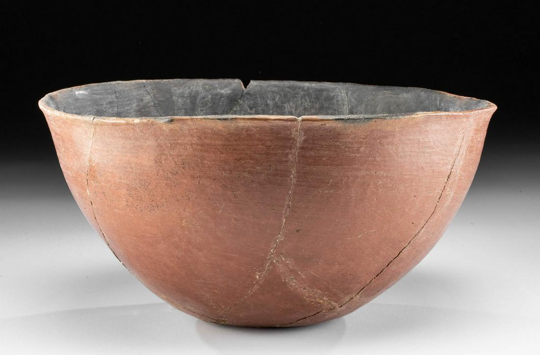 Egyptian Predynastic Naqada Redware Bowl: Ancient Egypt, Pre-Dynastic Period, Naqada II to III, ca. 3200 to 3000 BCE. A hand-built Nile silt pottery bowl with highly burnished surfaces, a lightly rounded but stable base, gradually expanding w