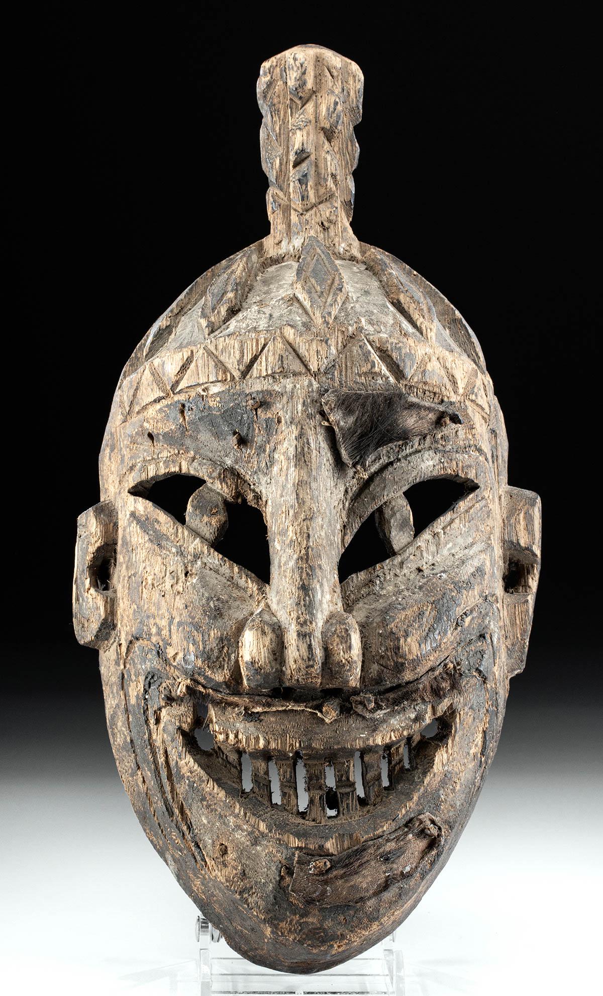 Late 19th C. Chinese Wooden Yao Priest / Shaman Mask: East Asia, China to northern Thailand, ca. late 19th century CE. A hand-carved wooden Yao mask with a hollow verso meant to be worn by a priest or shaman. The expressive countenance is painted with br