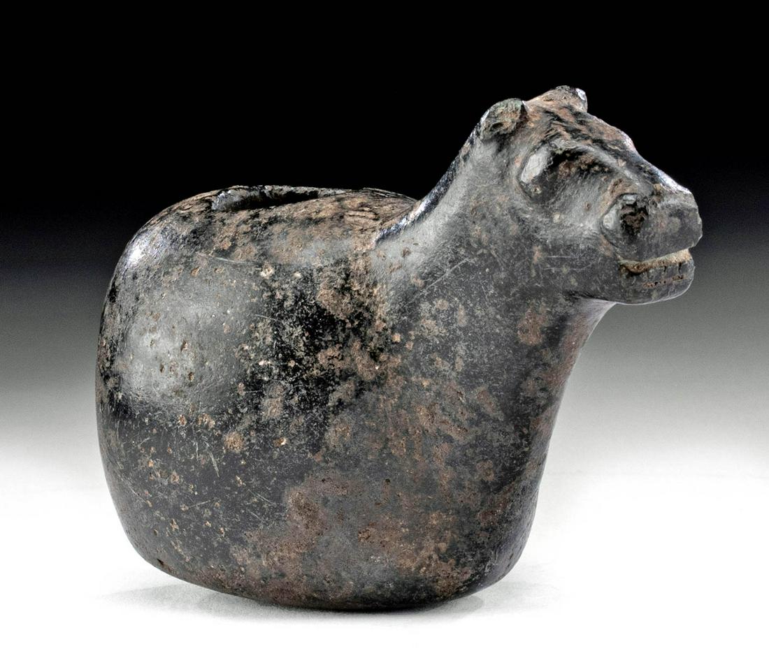 Inca Stone Canopa Camelid Form: Pre-Columbian, North Central Peru, Inca, ca. 1470 to 1523 CE. Hand-carved from deep black stone and polished until smooth, a petite ritual vessel known as a canopa. The camelid form presents with a ch