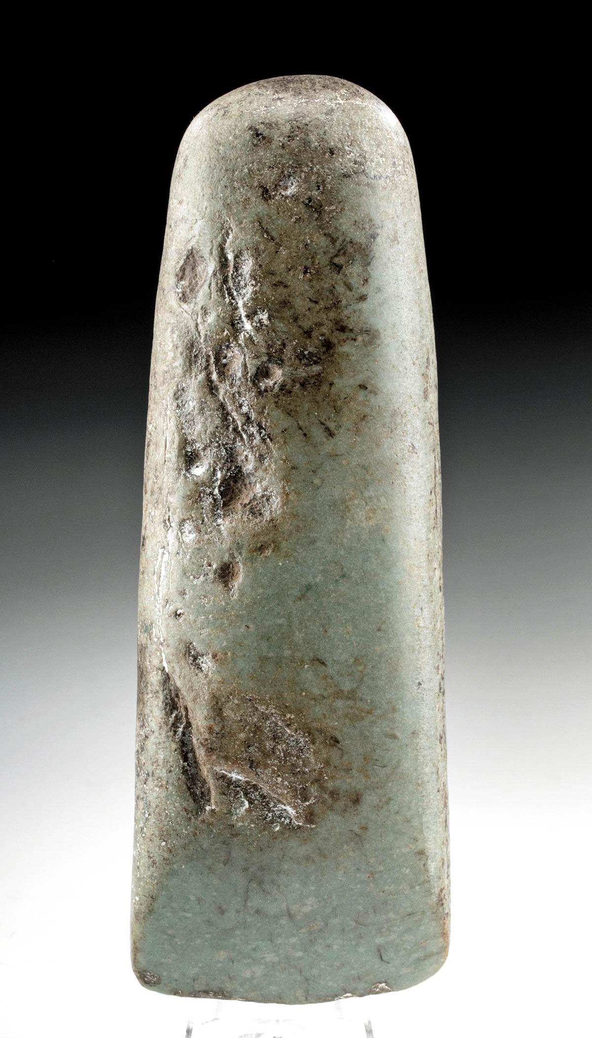Neolithic European Stone Axe Head (Time of Stonehenge): Northern Europe, Neolithic period, ca. 3500 to 2500 BCE. Made around the time Stonehenge was being created in England, this is a lovely gray-green stone axe head in a form known as "thick butted". It 