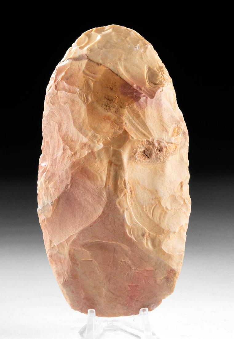 Moroccan Chert Acheulean Hand Axe: North Africa, Morocco, Acheulean tradition, ca. 1.6 million to 200,000 years ago. An expertly knapped chert hand axe, in the characteristic ovoid shape of this early hand tool. It has a thin profile a