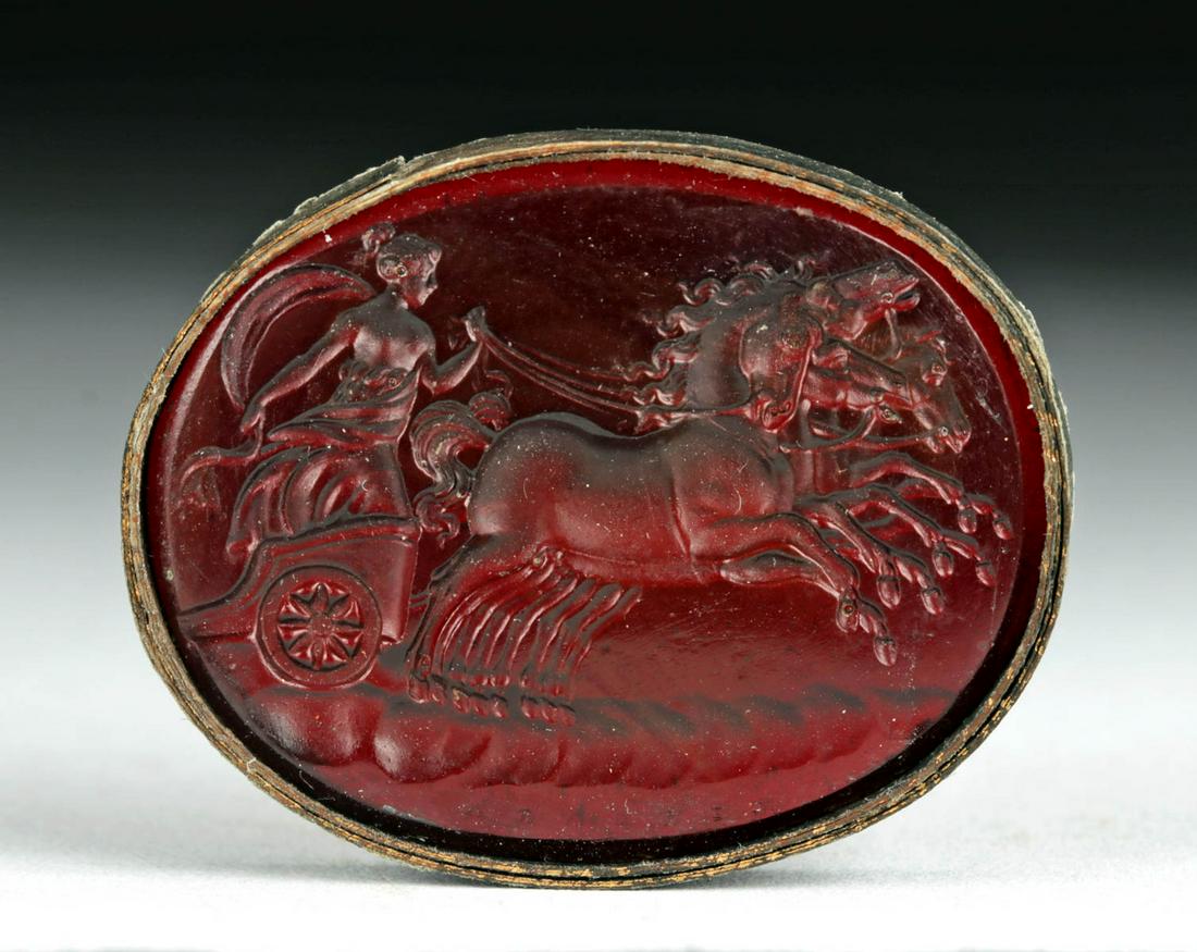 18th C. Neoclassical Glass Intaglio - Woman on Chariot: **Originally Listed At $250** Northern Europe, Neoclassical period, ca. 18th century CE. A deep red glass intaglio depicting a woman on a chariot driven by two horses. This may be a reference to Boudi