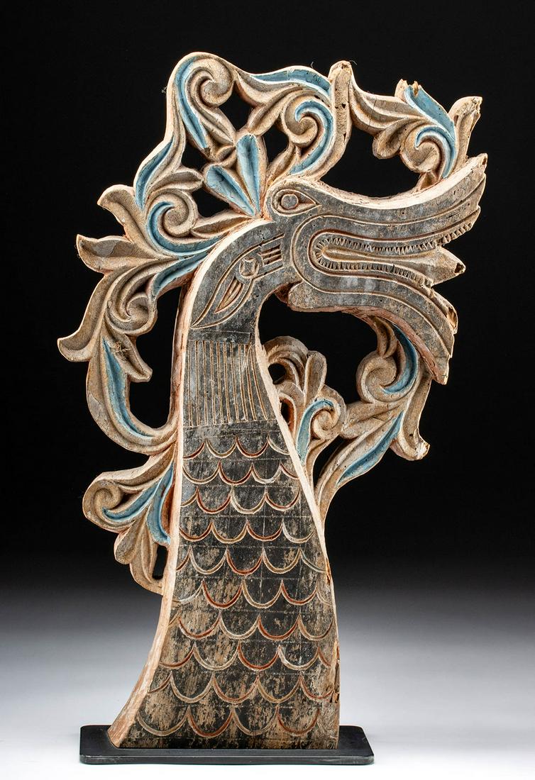 20th C. Indonesian Wood Dragon Finial / Prow: Southeast Asia, Indonesia, ca. mid 20th century CE. A striking wooden finial, made to adorn the prow of a canoe, featuring a dramatic and abstract carved dragon whose head and scaled neck are shown in