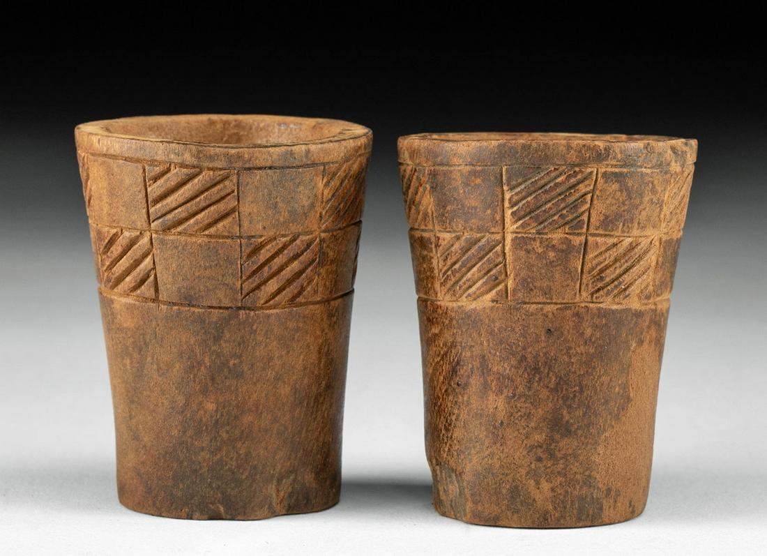 Rare Pair Inca Wood Keros w/ Incised Geometric Designs: Pre-Columbian, central Peru, Inca, ca. 1300 to 1500 CE. A wonderful and rare pair of miniature Incan kero (also qero, quero), each carved from a single piece of wood, with a gracefully flared and curv
