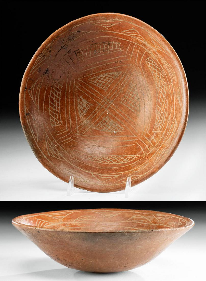 Calima Pottery Bowl w/ Incised Geometrics: Pre-Columbian, Colombia, Calima culture, ca. 600 BCE to 200 CE. A beautiful terracotta bowl elaborately decorated with incised geometrics and a rich red slip ground. The Calima people lived in central