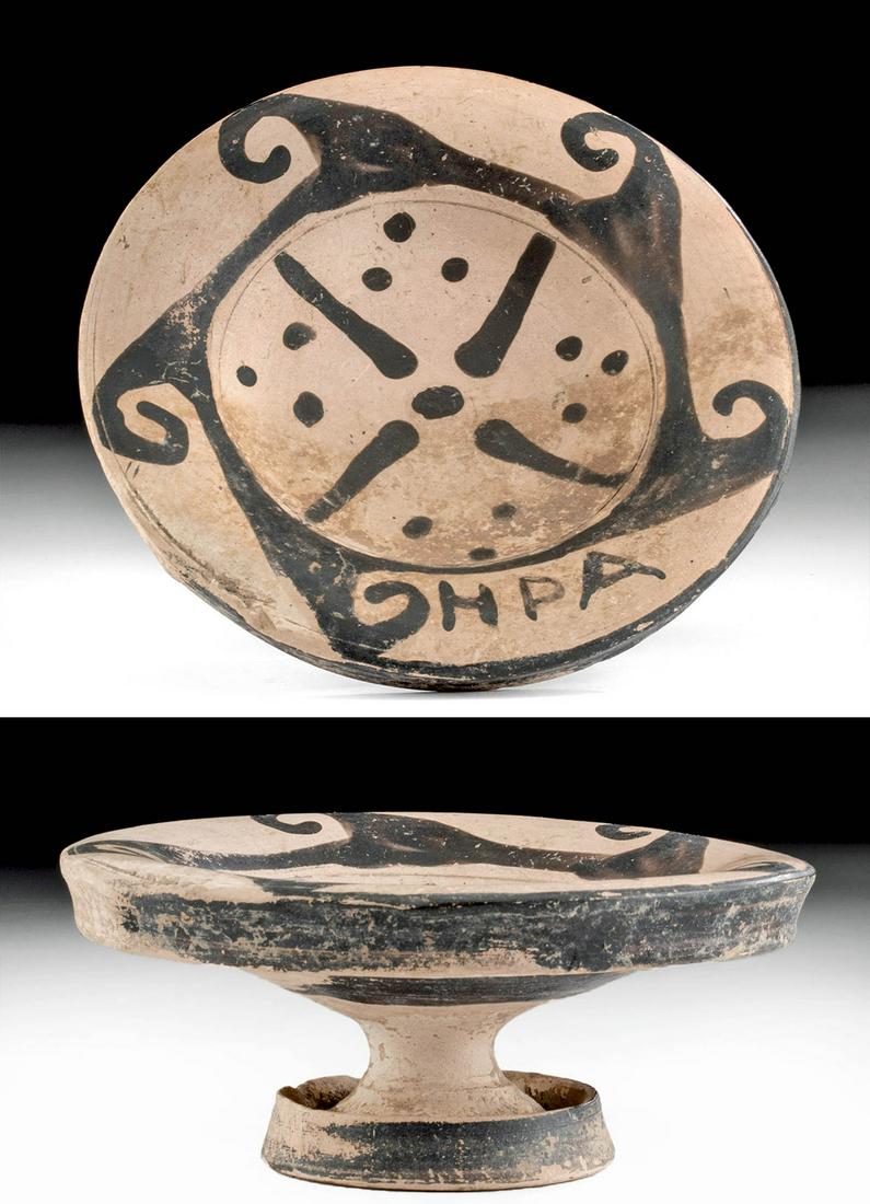 Rare Signed Etruscan Pottery Plate by Genucilia Group: Classical World, Etruria, central Italy, Genucilia Group, ca. 600 to 400 BCE. A bi-chrome pottery plate decorated with a four-pointed star on the shallow tondo and three dots within each of the inters
