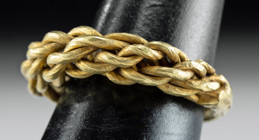 9th C. Viking Gold Twisted Ring, US Ring Size 8: Northern Europe, Viking culture, ca. 9th to 11th century CE. A solid gold ring made of twisted, braided 16 karat gold wires that taper a solid gold band. This would have belonged to a wealthy Viking w