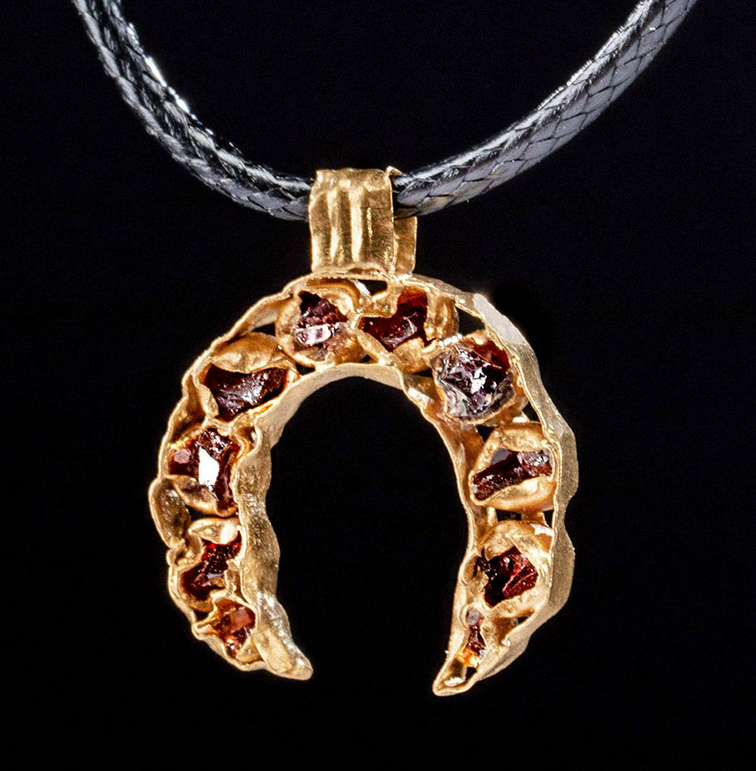 Ancient Roman 22K+ Gold Pendant w/ Garnets - 1.5 g: Roman, late Imperial to early Byzantine period, ca. 4th to 6th century CE. A gorgeous lunate pendant with a crescent-shaped body formed from delicate 97% gold (equivalent to 22K+) panels and bearing t