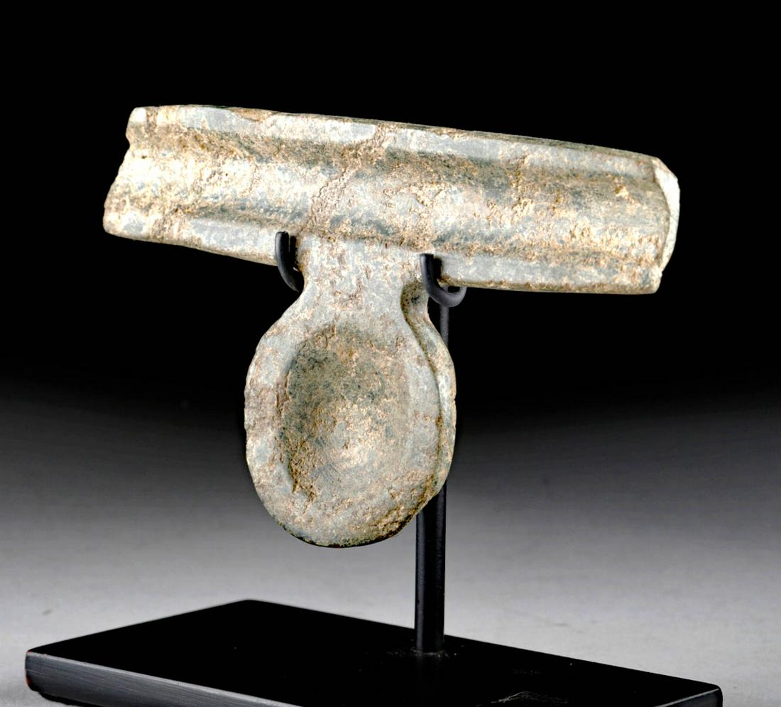 Olmec Greenstone Pendant / Drug Spoon: Pre-Columbian, southern Mexico/Guatemala, Olmec culture, ca. 1150 to 550 BCE. A stone spoon of grey-green hues and an interesting form. A long, rectangular trough is at the top, pierced through the ba