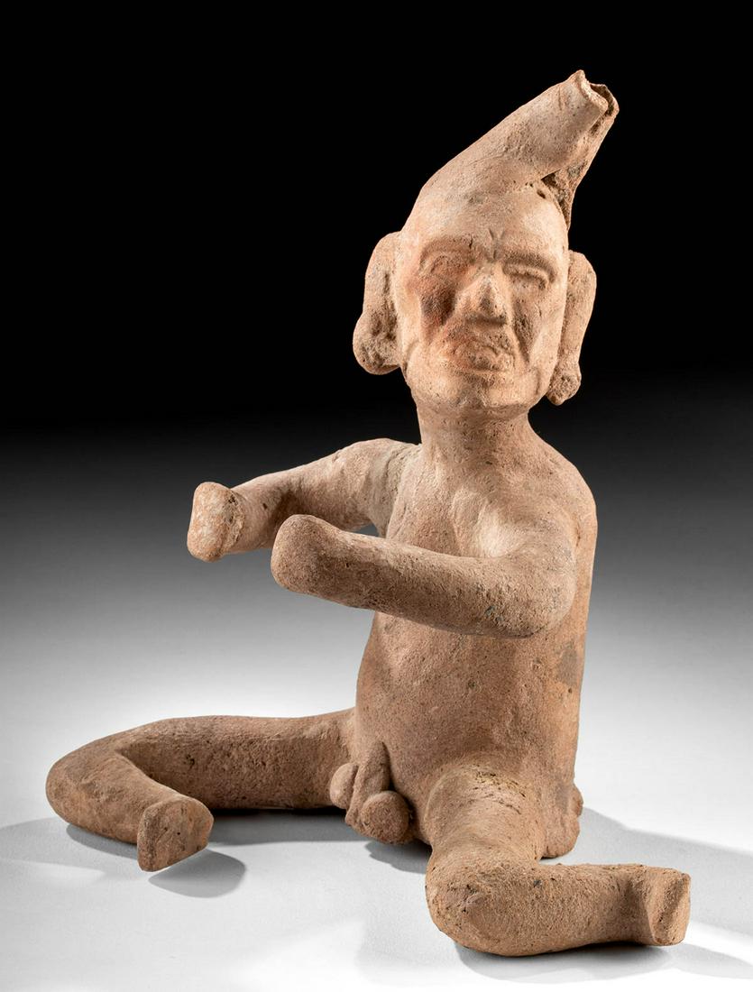 Veracruz Ceramic Figure - Nude Old God: Pre-Columbian, Mexico, Vera Cruz culture, ca. 6th to 8th century CE. A fascinating ceramic figure of a nude man with a frightening, skeletal face upturned to the viewer, his leering grin and sunken ch