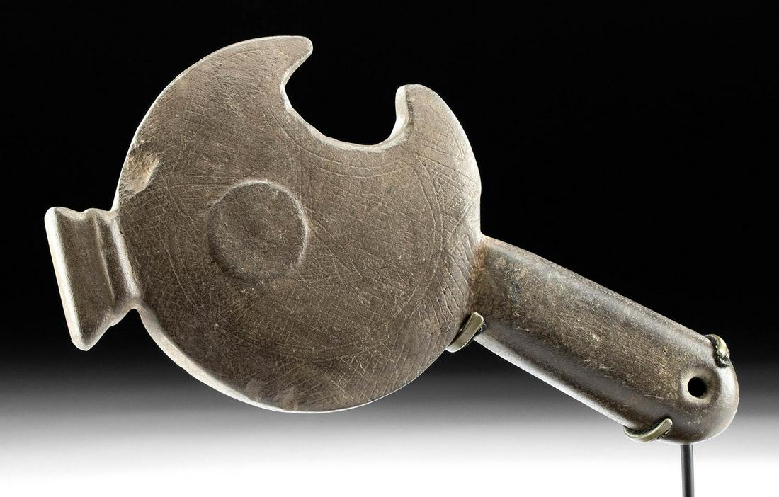 Mapuche Stone Clava w/ Abstract Macaw Head: Pre-Columbian, South America, Argentina or Chile, Mapuche culture, ca. 1200 to 1700 CE. A finely carved, dark gray stone scepter of a ceremonial form known as a clava with a lunate head depicting an a