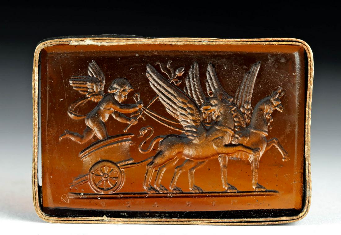 18th C. Neoclassical Glass Intaglio - Cupid & Griffins: Northern Europe, Neoclassical period, ca. 18th to early 19th century CE. A charming translucent russet glass intaglio depicting Cupid (Eros) in a chariot pulled by two griffins. The Neoclassical perio