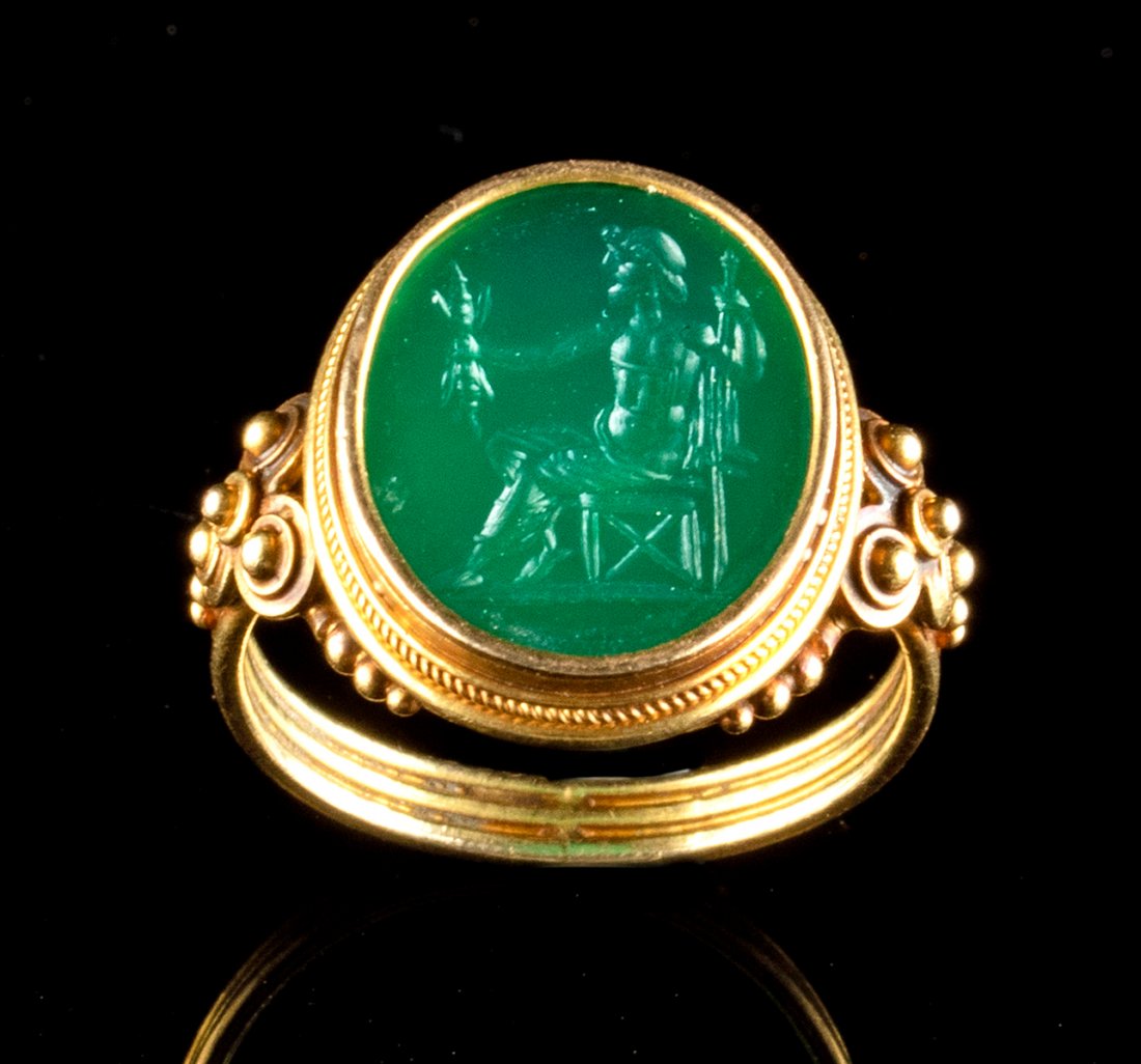 18th C Neoclassical Gold Ring, Emerald Intaglio Jupiter: Western Europe, Neoclassical Period, ca. 18th to early 19th century CE. A gorgeous and wearable ring composed of 87% gold (equivalent to 20K+) with an ovoid emerald intaglio depicting Jupiter (Greek Z