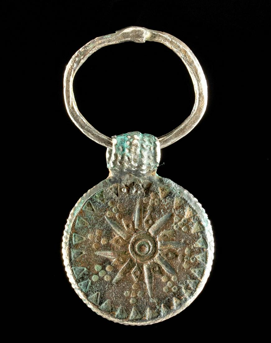 Pre-Viking Silver Bracteate Pendant - 23.7 g: Northern Europe, Scandinavia, Pre-Viking or early Viking period (often called Migration period or Germanic Iron Age), ca. 6th to 7th century CE. A gorgeous bracteate pendant of a circular form made fr